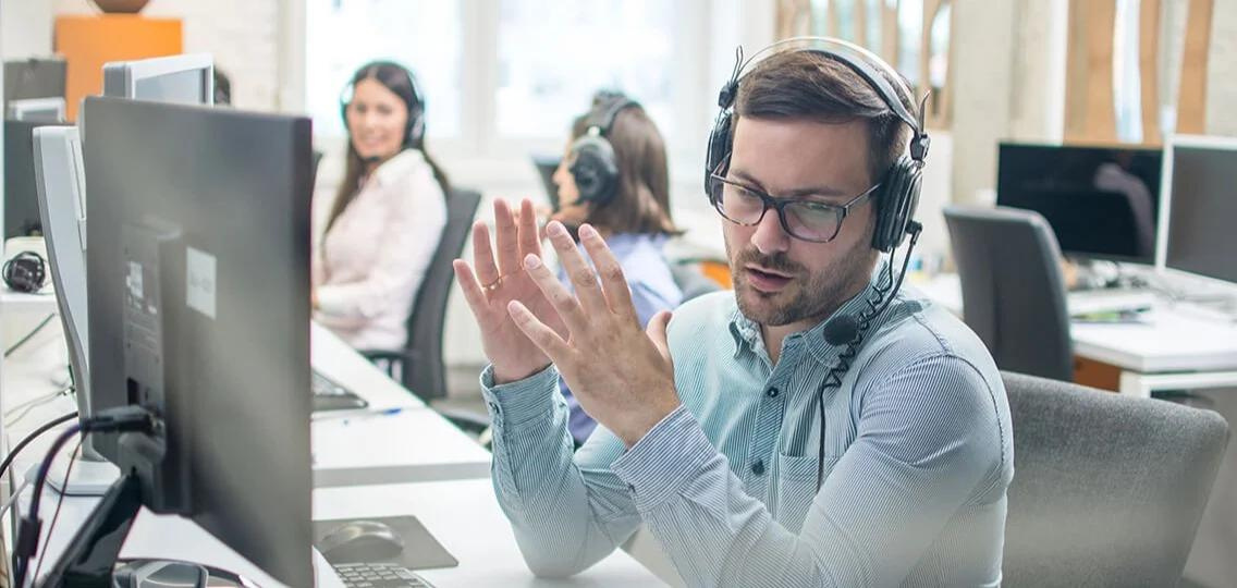 A person wearing headphones in a call center HVAC Toronto