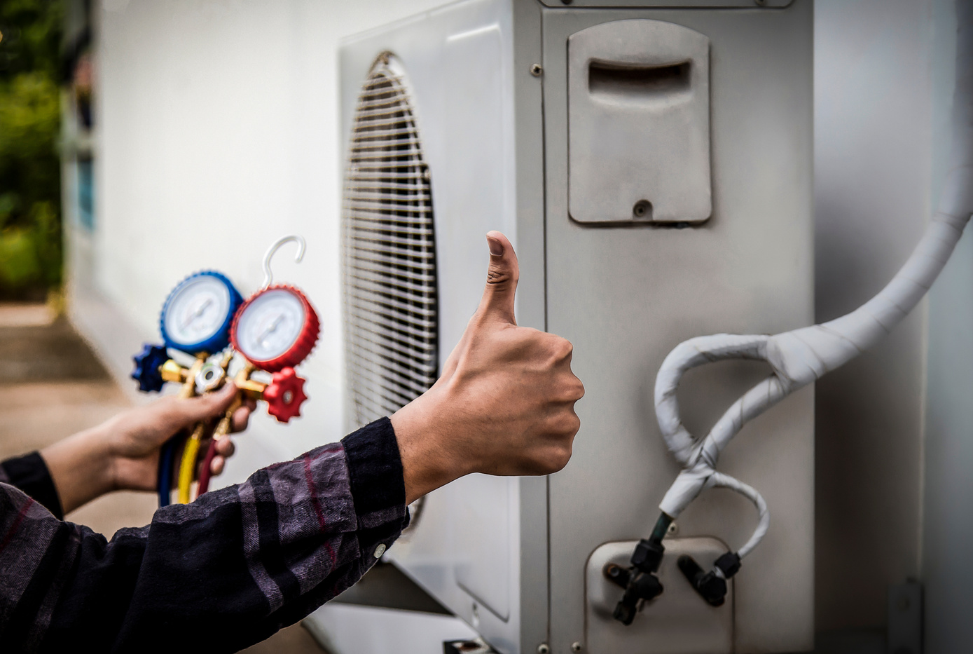 a person holding up two thumbs next to an air conditioner, HVAC Toronto